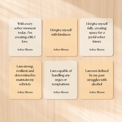 6 Affirmation cards reading: "With Every sober moment today, I'm creating a life i love", "I forgive myself with kindness", "I forgive myself fully, creating space for a joyful sober future", I am strong, resilient, and determined to maintain my sobriety", " I am capable of handling any urges or temptations", " I am not defined by my past struggles with alcohol".